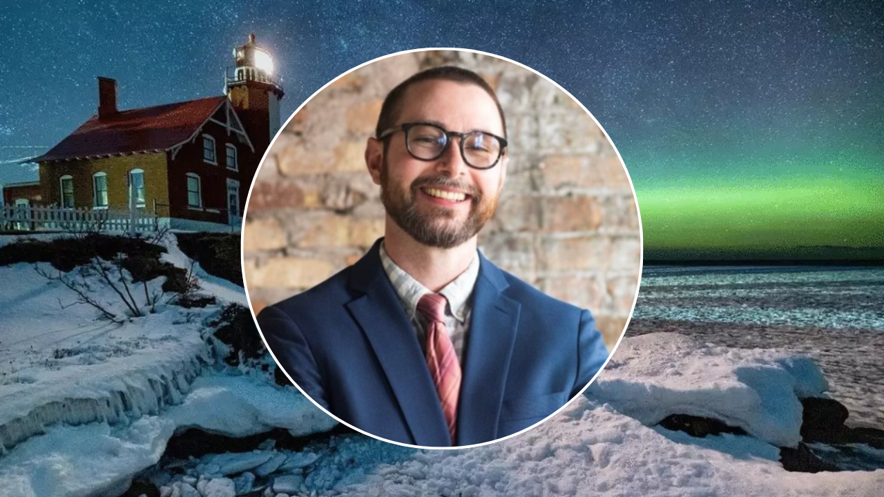 A starry sky with northern lights and snow; a portrait photo of Brad Keweenaw