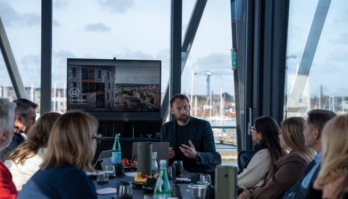 A man from Lendager speaks to attendees.